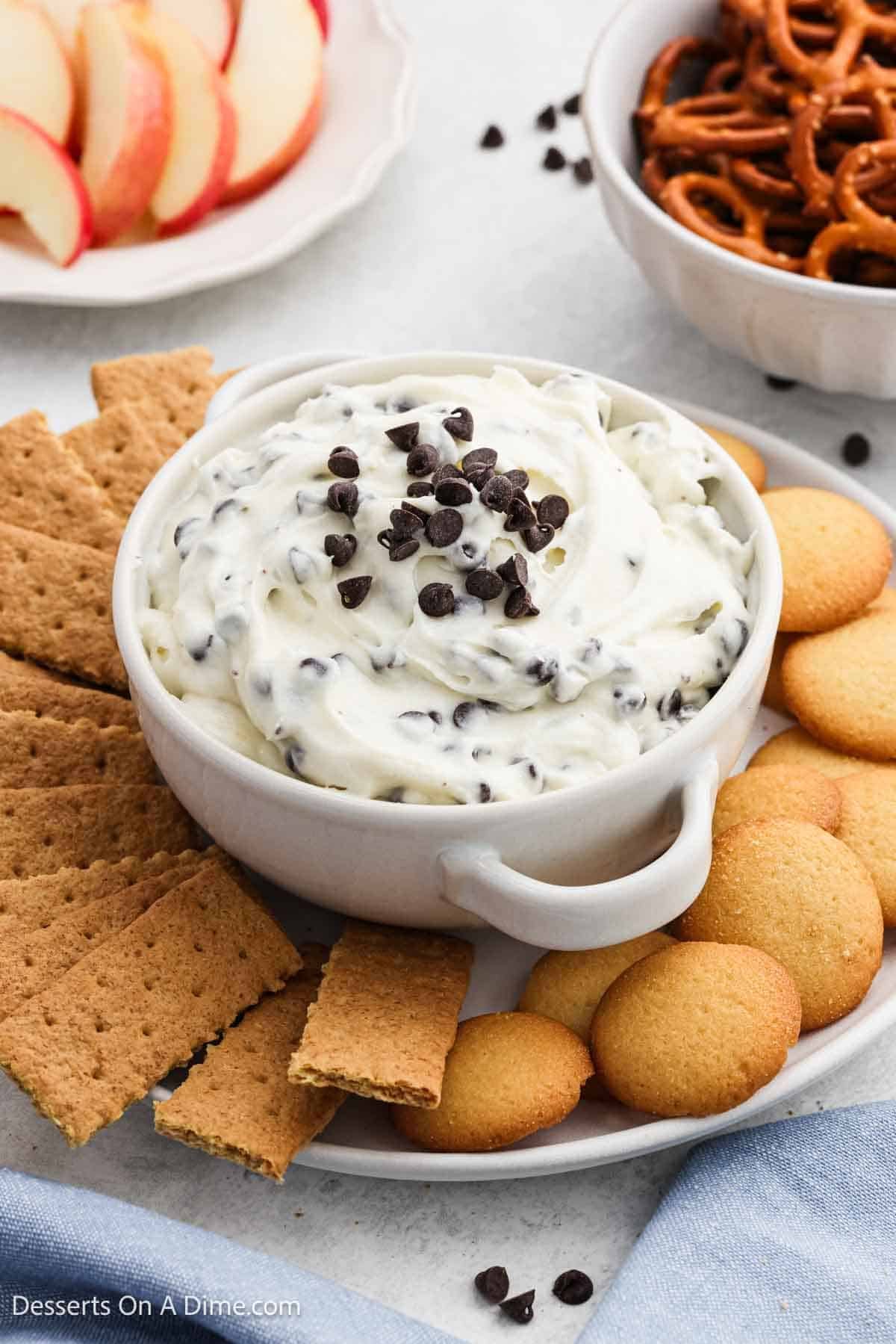 Dessert dip with chocolate chips in a bowl with dippers. 