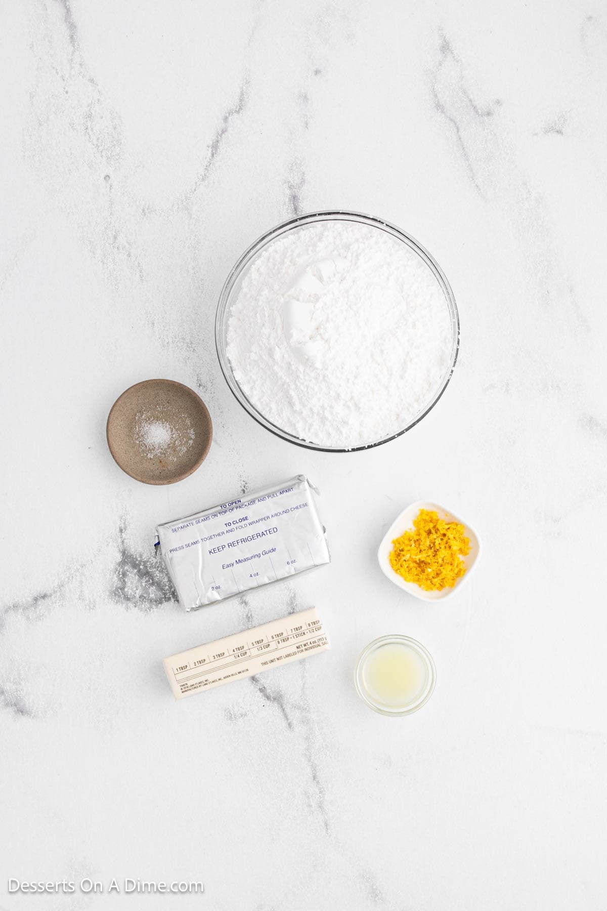Ingredients for recipe - cream cheese, butter, lemon, salt, powdered sugar and lemon juice. 