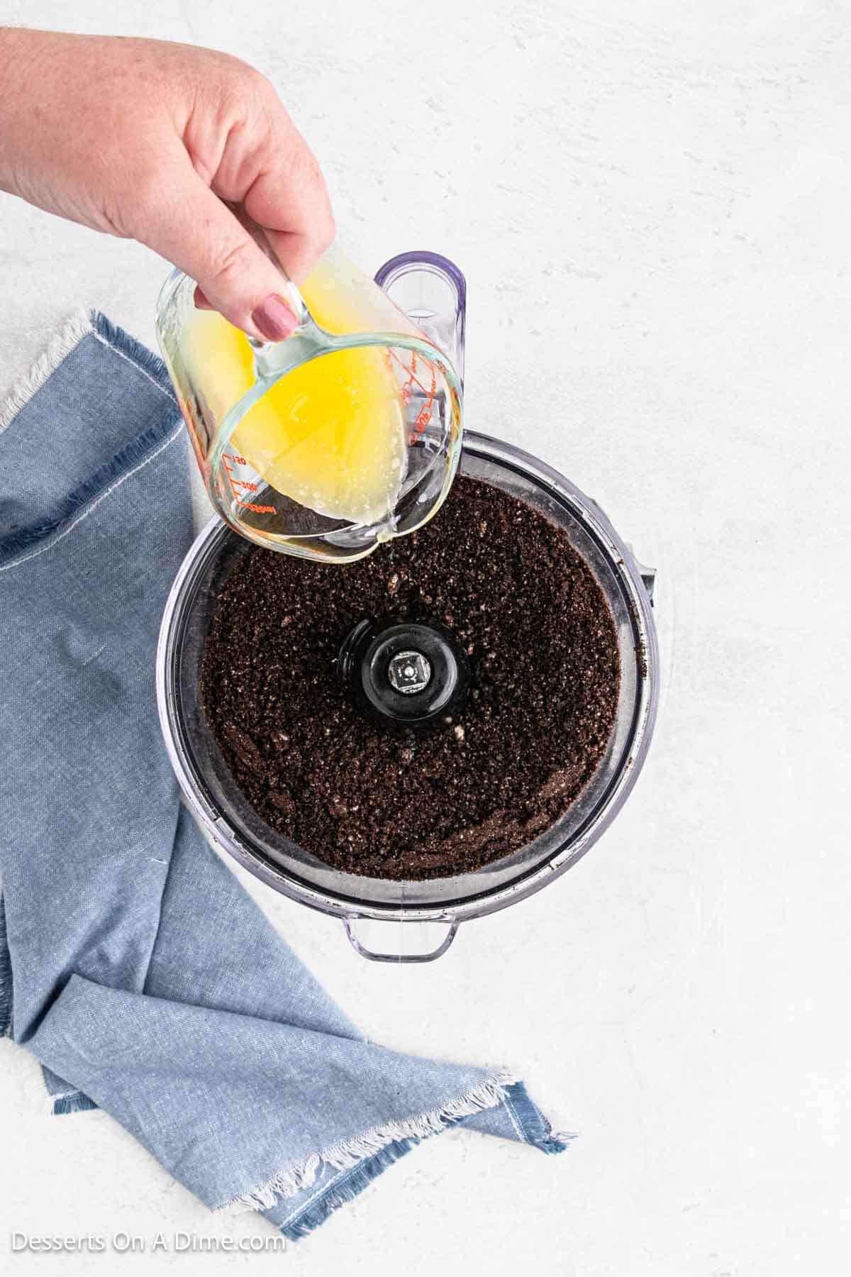 Butter poured into food processor.