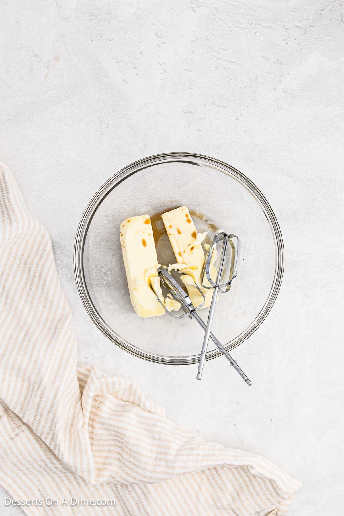 Butter and vanilla in a mixing bowl. 
