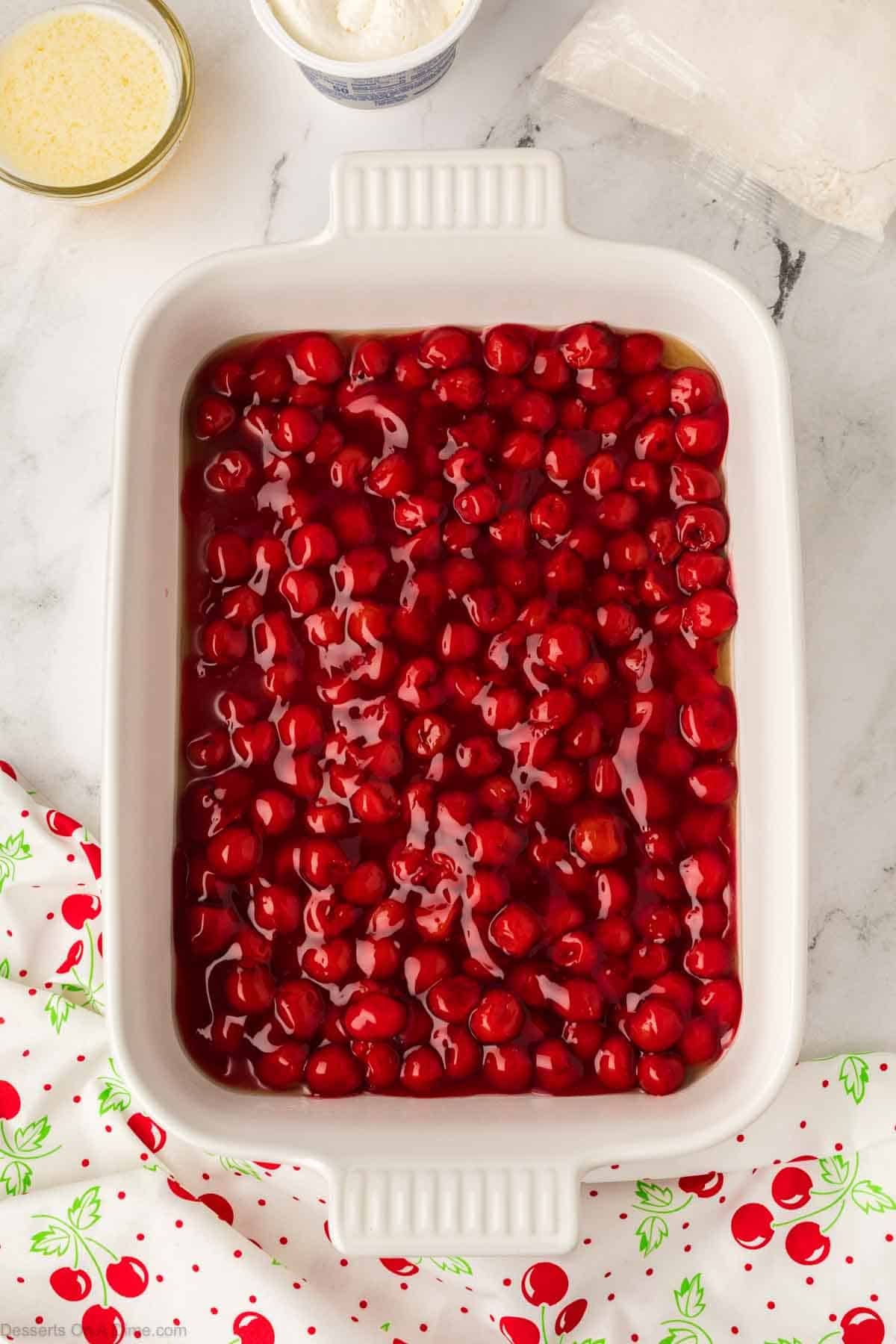 Cherry pie filling in a baking dish. 