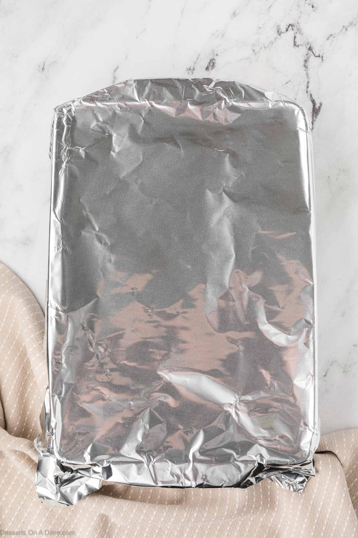 Foil on top of baking dish. 