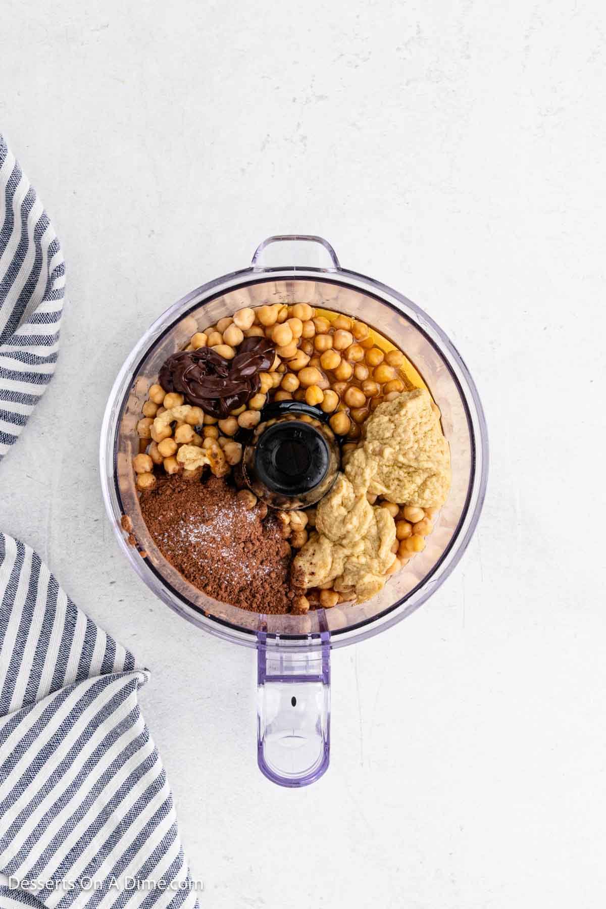 Ingredients in food processor ready to blend together.