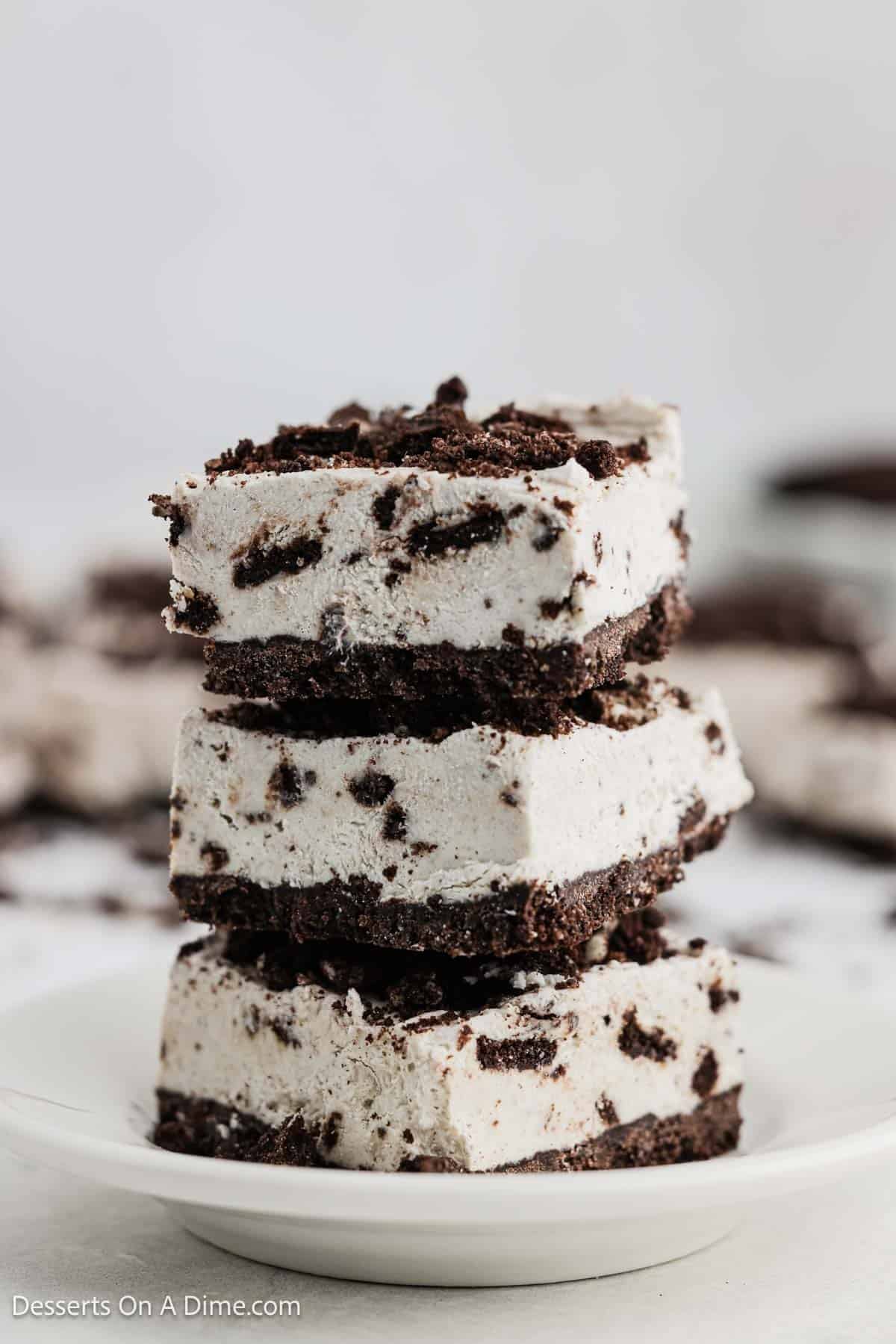 No Bake Oreo Bars cut into squares on a plate.