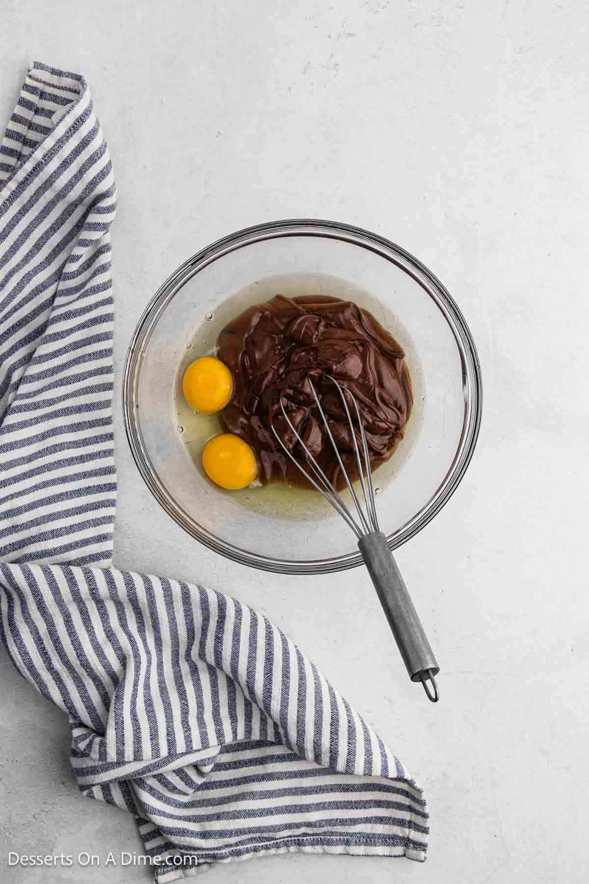 Mixing bowl with nutella and eggs.