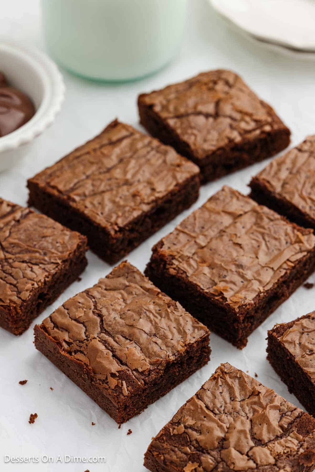 Nutella Brownies cut into bars and placed on parchment paper.