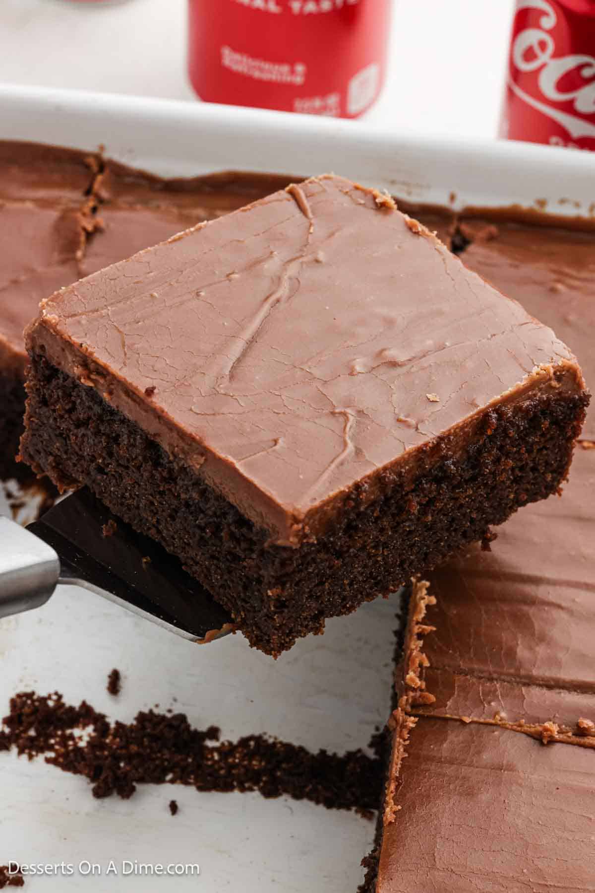 Frosting spread on cake and sliced. 