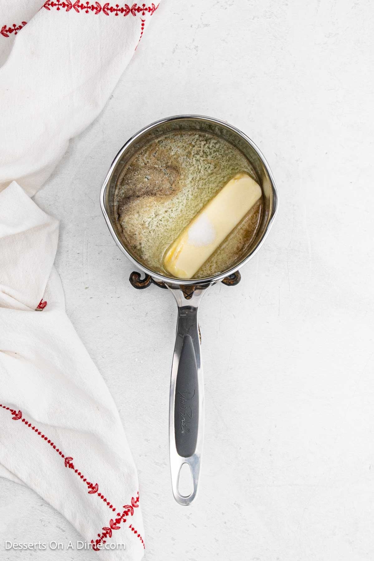 Butter added to mixture in pan. 