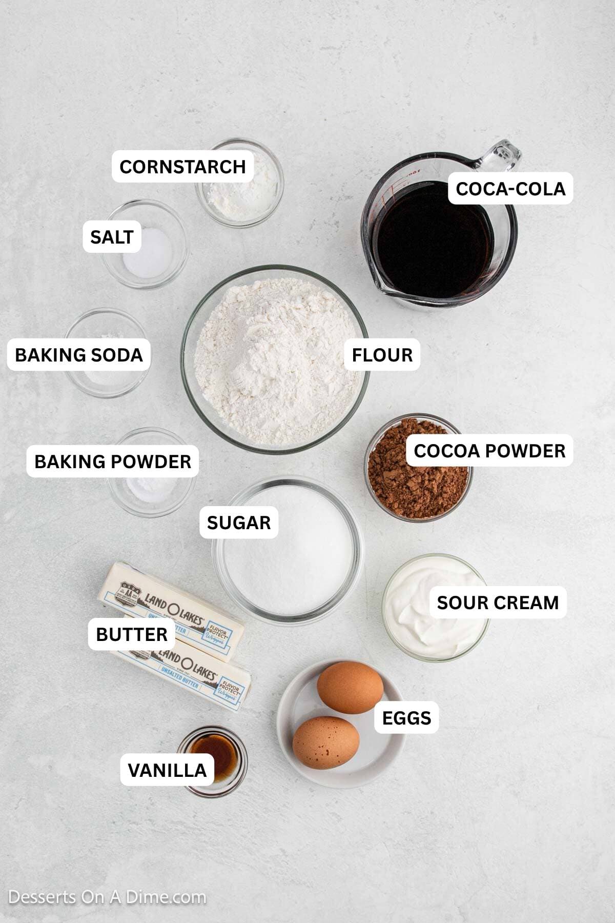 Ingredients or recipe: vanilla, eggs, butter, sour cream, sugar, cocoa powder, baking powder, baking soda, flour, salt, coco cola and cornstarch. 