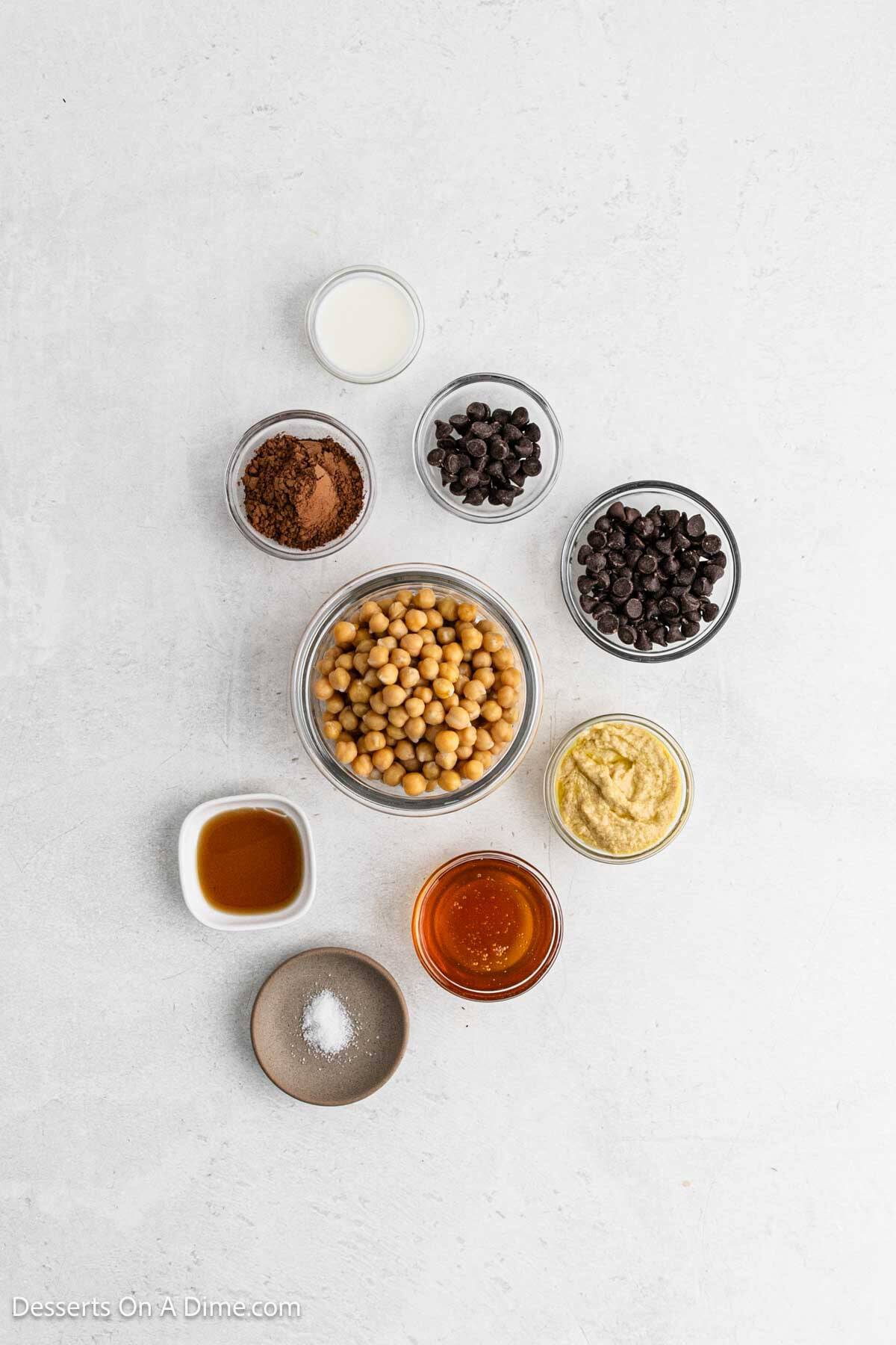 Ingredients for recipe: sugar free chocolate chips, chickpeas, tahini paste, honey, cocoa powder, vanilla, sea salt and milk.