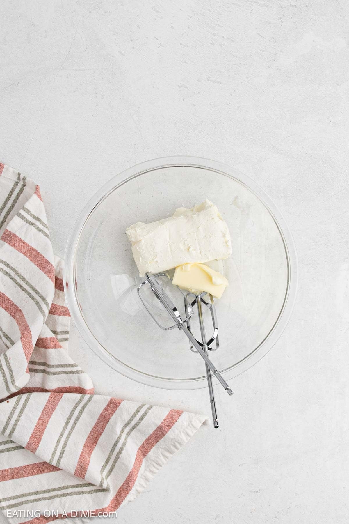Cream cheese and butter in a bowl to cream together. 